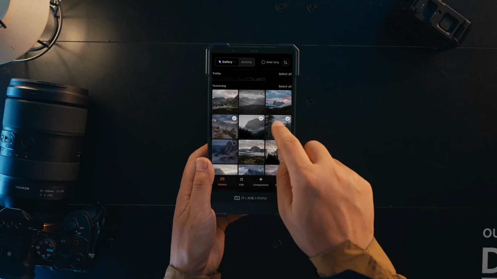 Hands browsing and selecting photos in the PixelMob gallery